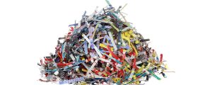 Pile of colorful shredded paper on a white background for shred event